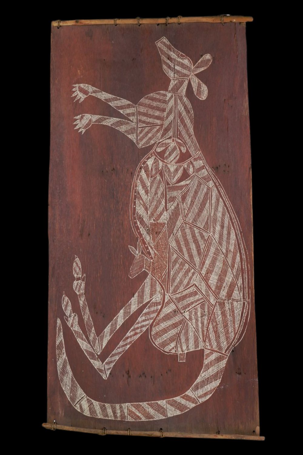 Bobby ngainjmirra kangaroo Bobby Ngainjmirra bark painting of a kangaroo with joey, featuring intricate white rarrk (crosshatching) on red ochre bark, showcasing traditional Arnhem Land x-ray style and ancestral connections to country and kinship.