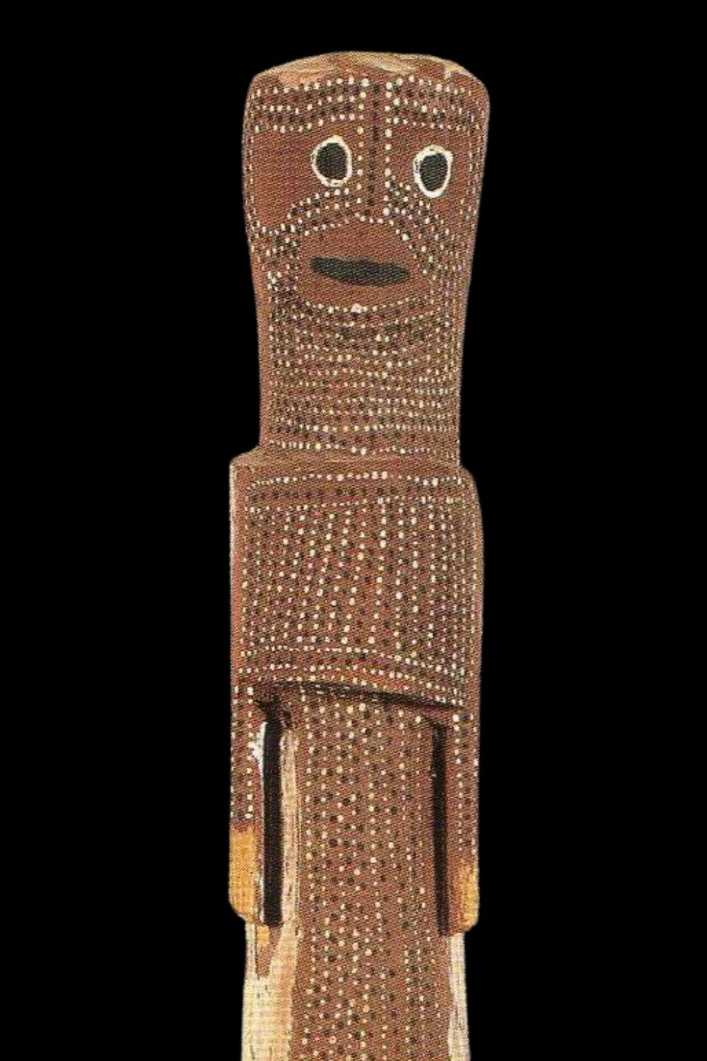 Close-up of Crusoe Kuningbal Mimih spirit sculpture – detailed Aboriginal carving from Arnhem Land featuring traditional white and black dot ornamentation, ochre pigmentation, and a stylised face, exemplifying Kuningbal’s innovative bark painting and sculptural legacy