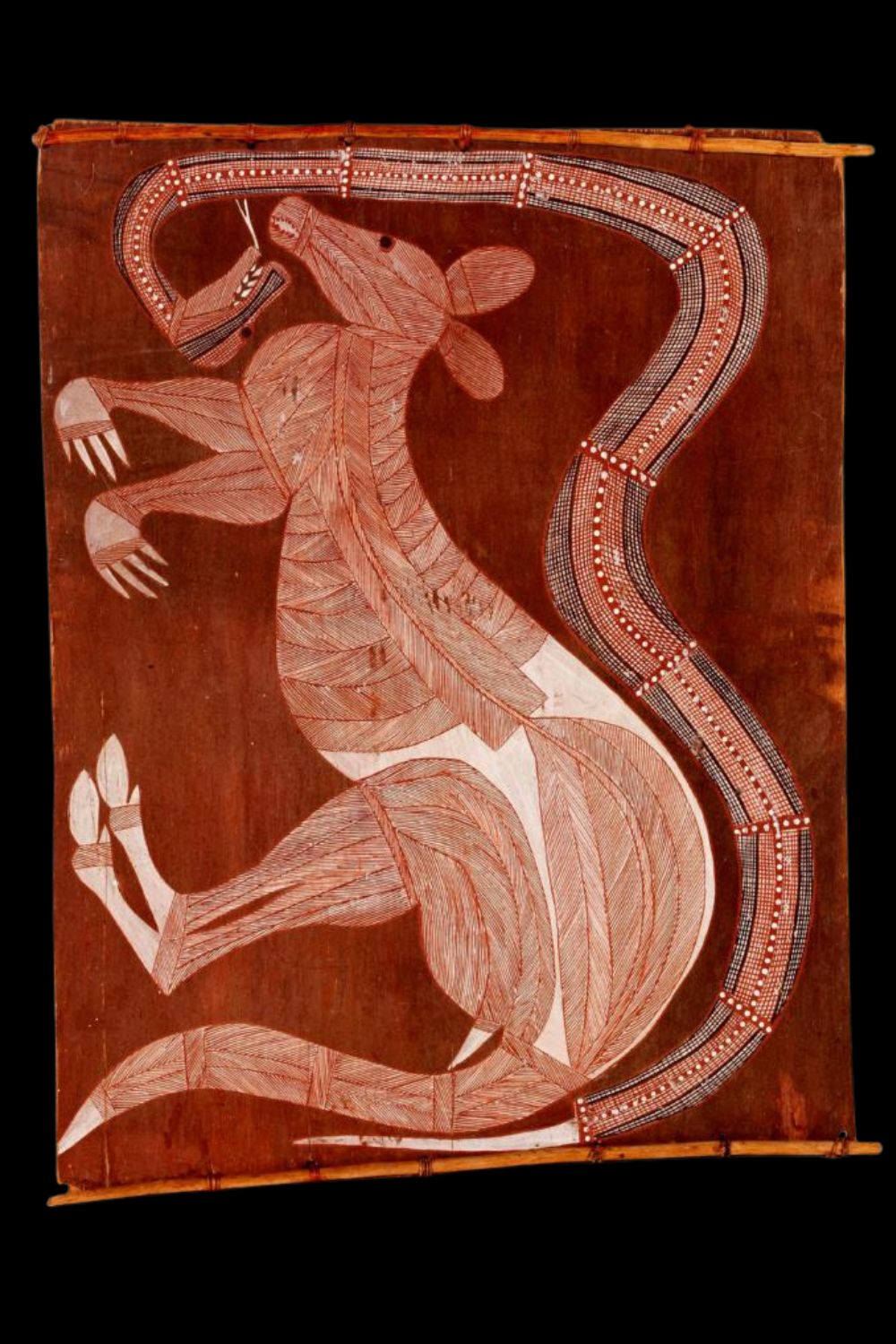 John-Namerredje-Guymala serpent and kangaroo Arnhemland bark painting by Namerredje Guymala depicting a serpent and kangaroo on a red ochre background