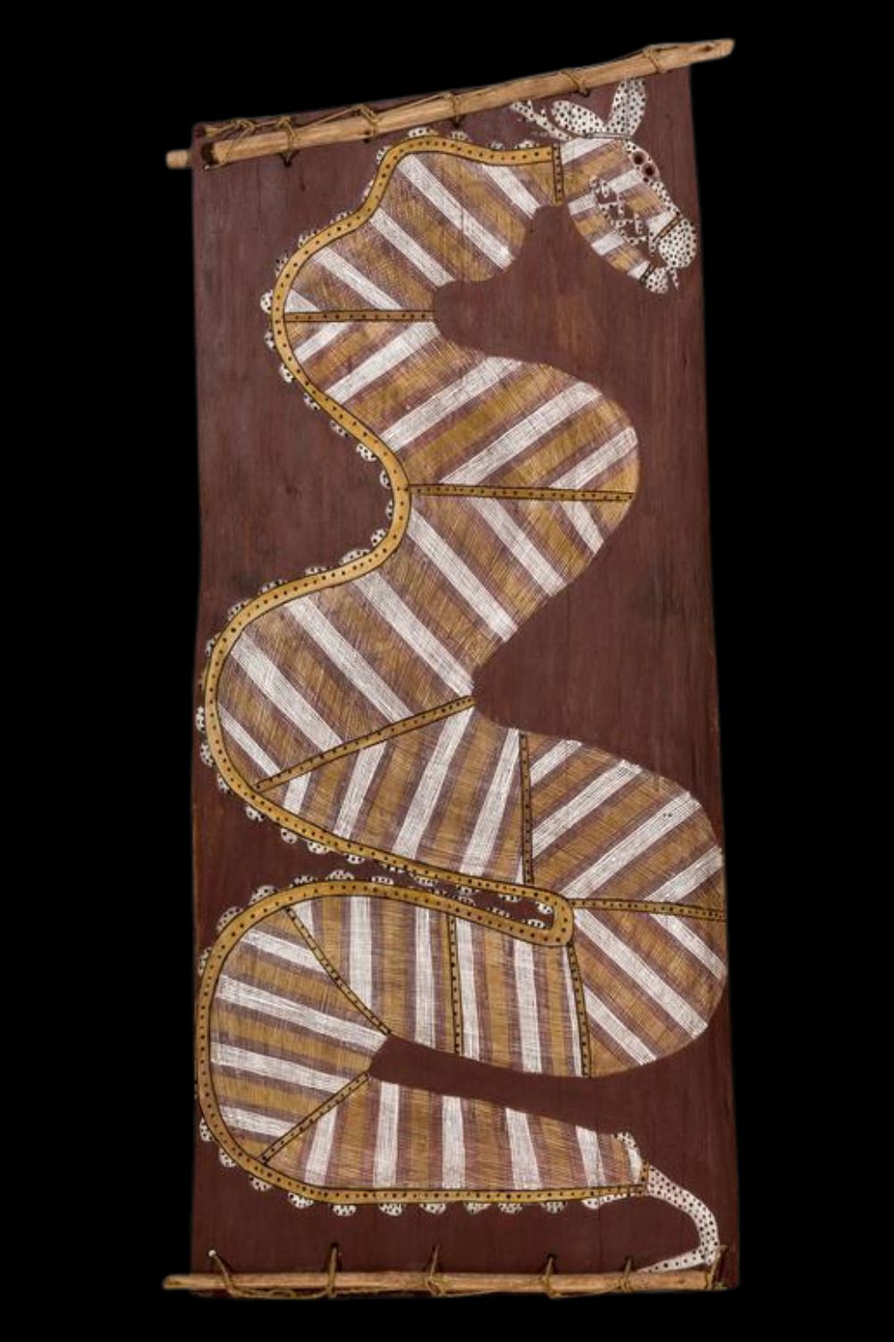 Aboriginal bark painting by Mick Kubarrku depicting Ngalyod the Rainbow Serpent in natural ochres with fine linear patterning in the traditional Oenpelli style.
