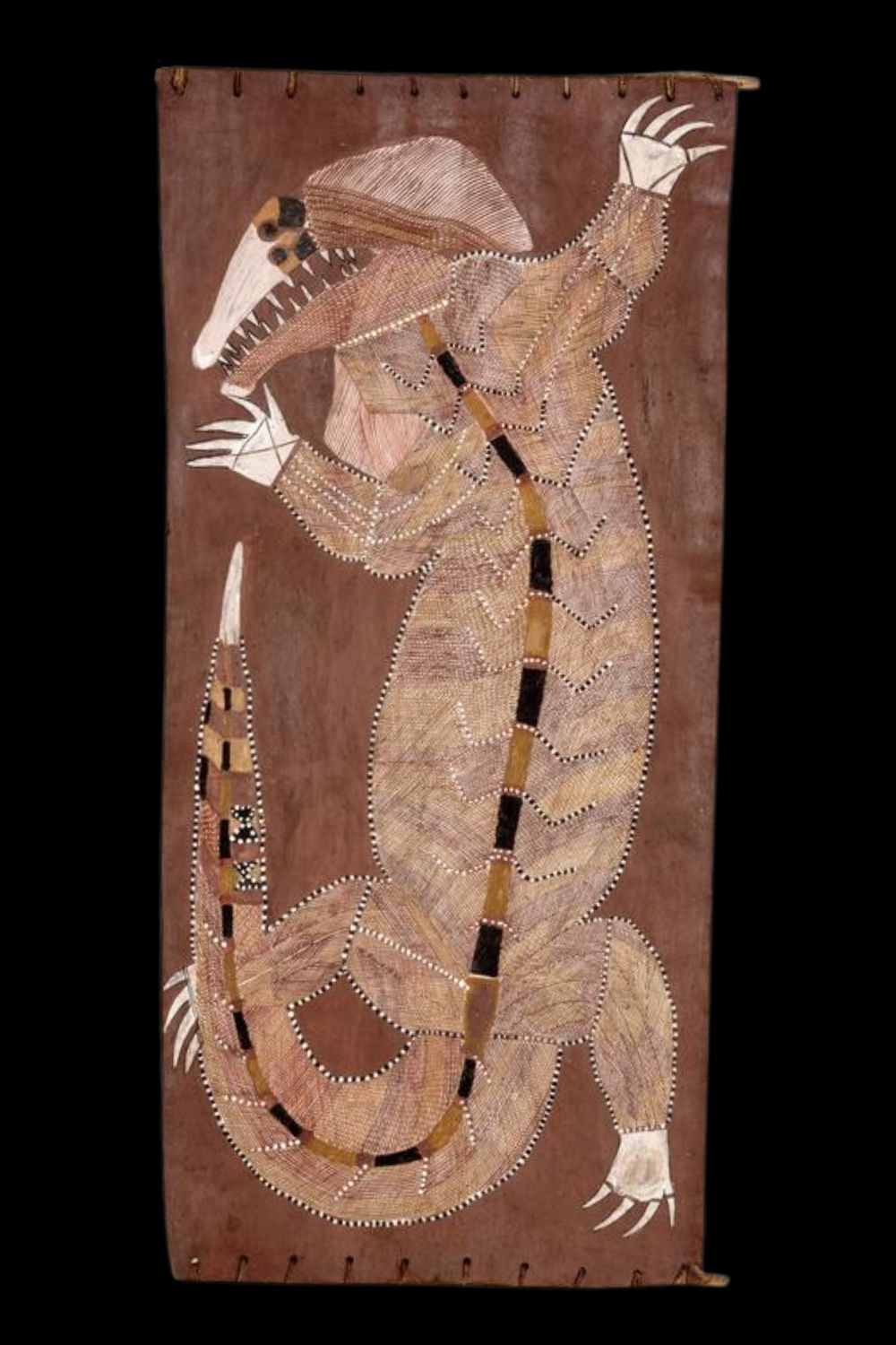 Bark painting by Aboriginal artist Mick Kubarrku depicting a stylized spirit figure with angular limbs and a dotted white face, outlined in traditional rarrk (crosshatching) using ochre tones of white, yellow, and red on a natural bark surface. The figure is centered with symmetrical, elongated arms and legs, and is framed by natural wood crossbars