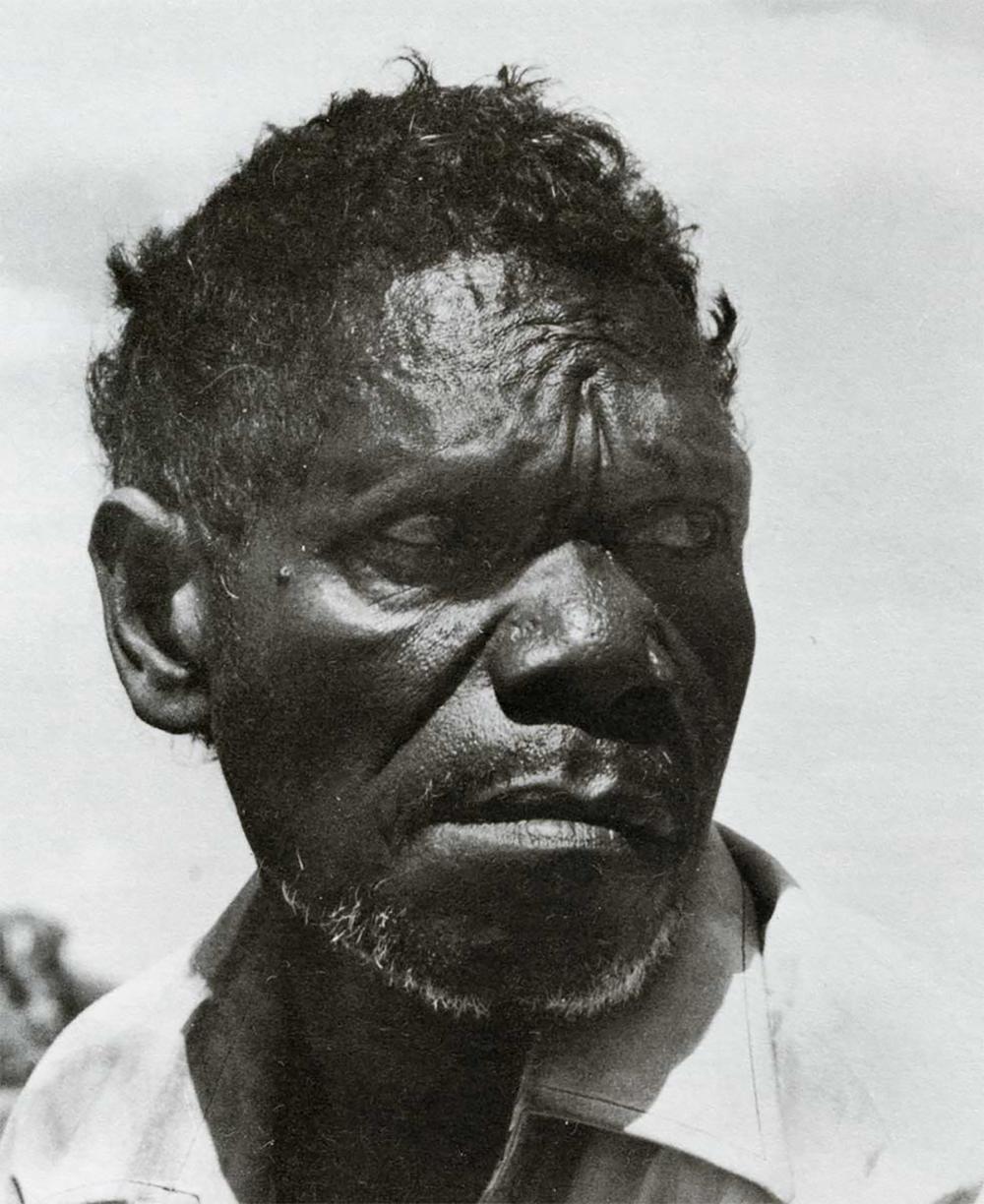 Photo of Dick Murrumurru Nguleingulei Black and white portrait of Dick Murrumurru Nguleingulei, renowned Aboriginal bark painter from Western Arnhem Land, known for his depictions of ancestral spirits and Lightning Man (Namarrkon); image reflects the dignity, cultural authority, and artistic legacy of a senior Kunwinjku lawman and ceremonial leader.