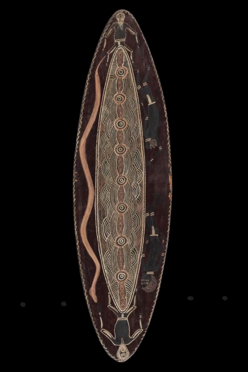 Aboriginal art by Charlie Brinken on a churinga shaped panel of bark with churinga like designs and figures