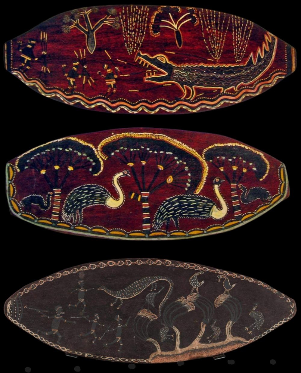 three oval shaped bark paintings by Charlie Rock Ngumbe depicting flora and fauna and hunting scenes