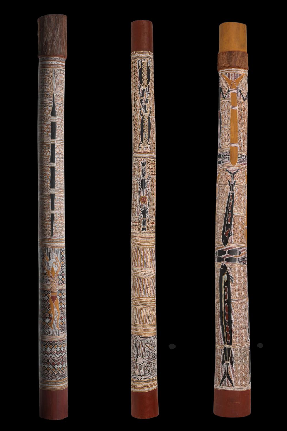 Three painted ceremonial poles by Gawirrin Gumana 