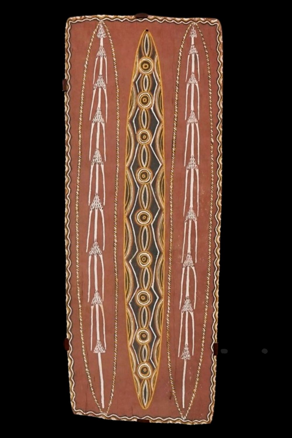 Aboriginal bark painting by Charlie Rock Ngumbe depicting a central elongated oval churinga flanked on either side of side by ceremonial spears