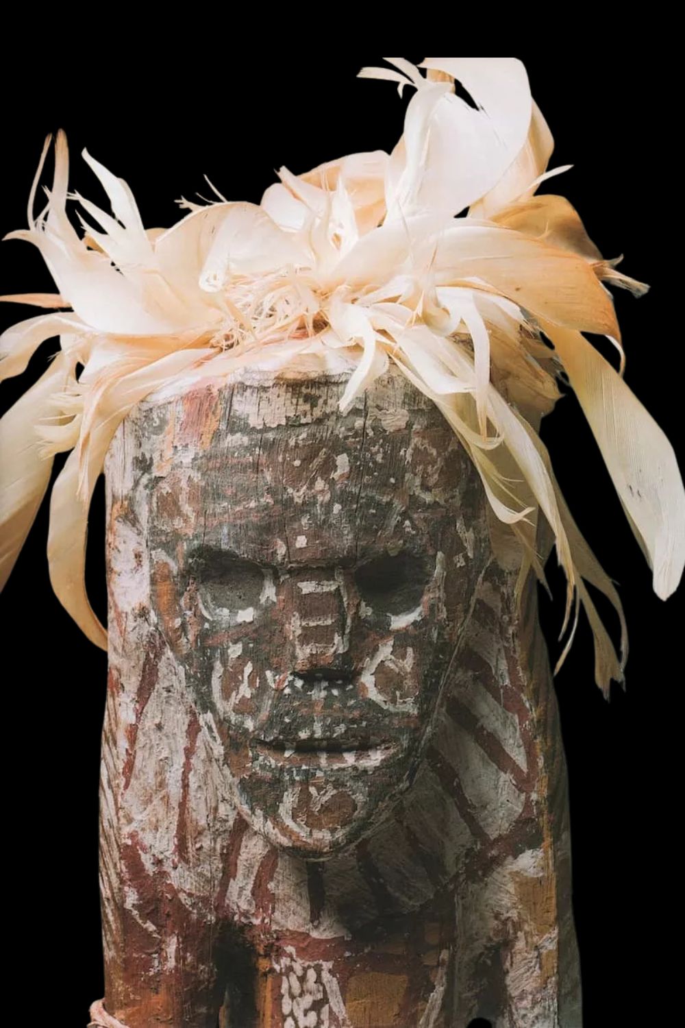 Aboriginal sculpture painted with bird feathers on the head and a masterpiece of Tiwi Art