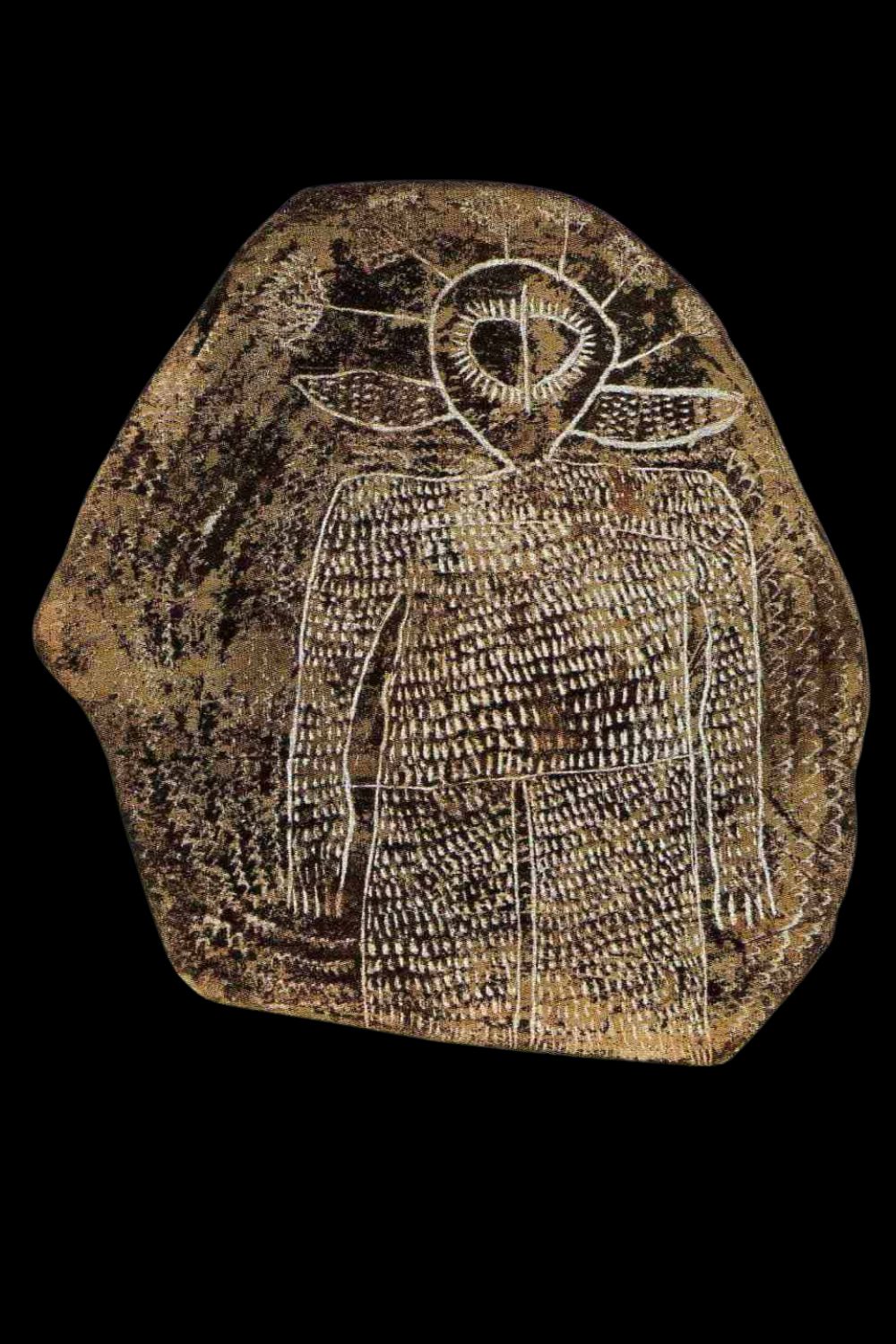 Alec Mingelmanganu engraving of a wandjina on slate Alec Mingelmanganu engraving of a wandjina on slate