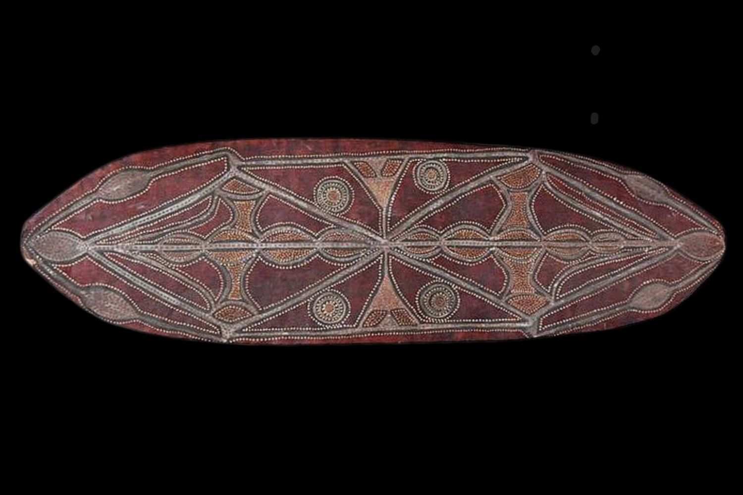Abstract ceremonial bark painting by Charlie Rock Ngumbe featuring geometric symbolic imagery in natural ochres from the Port Keats tradition