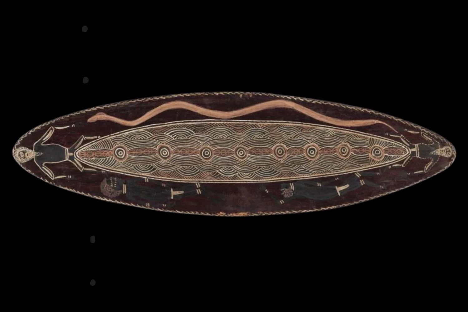 Early Port Keats bark painting by Charlie Brinken depicting ceremonial symbolic imagery and concentric linear designs on elongated eucalyptus bark