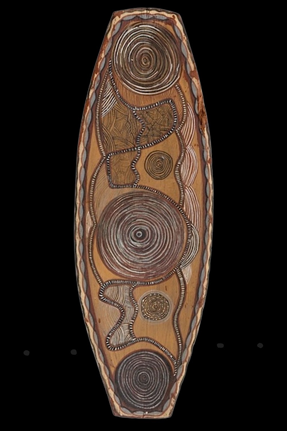 Early Port Keats Aboriginal bark painting by Charlie Mardigan featuring concentric ceremonial designs in natural ochres on elongated eucalyptus bark