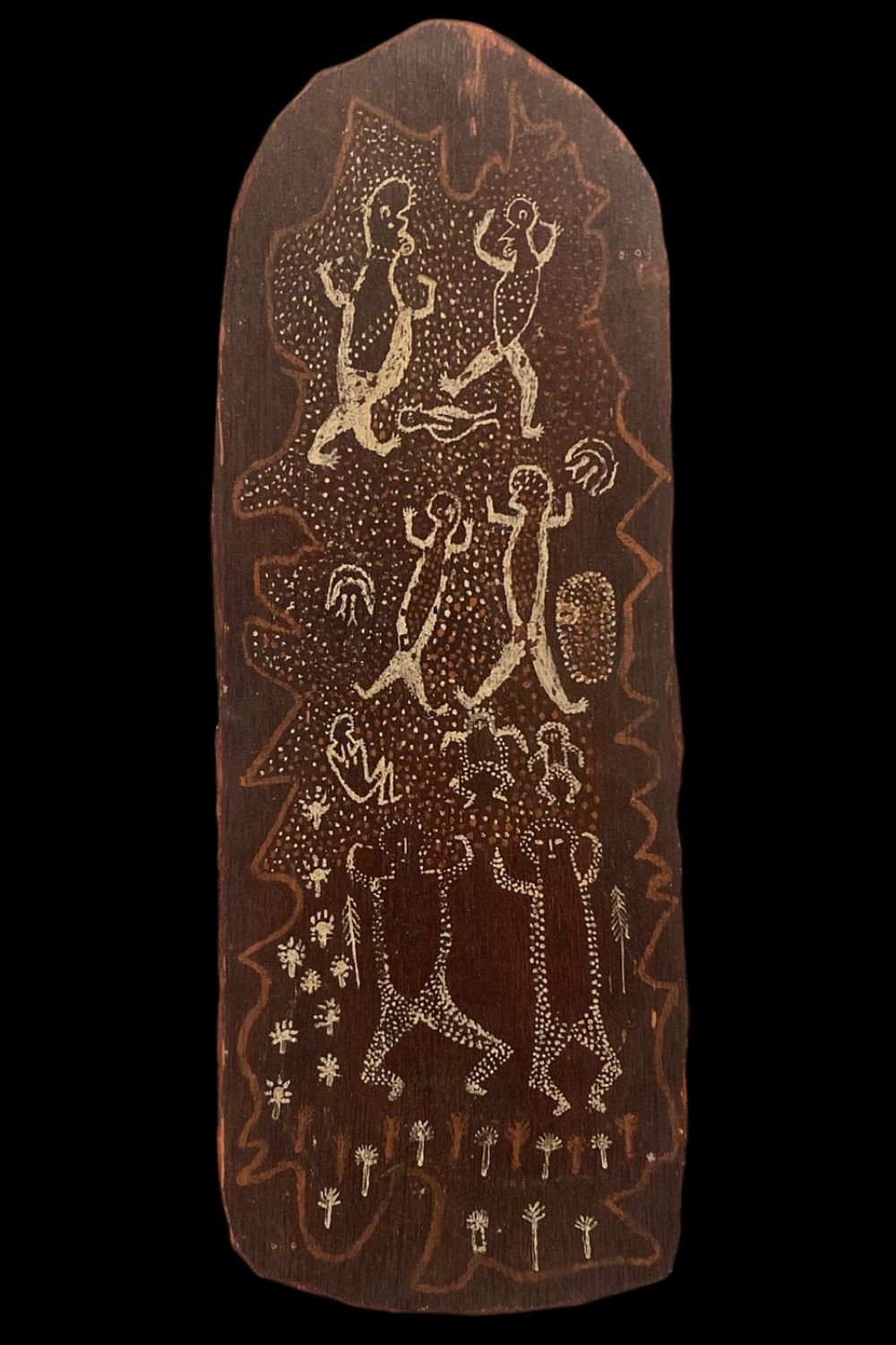 Early Tiwi figurative bark painting showing ceremonial human figures, and dotted ochre designs on eucalyptus bark from the Tiwi Islands