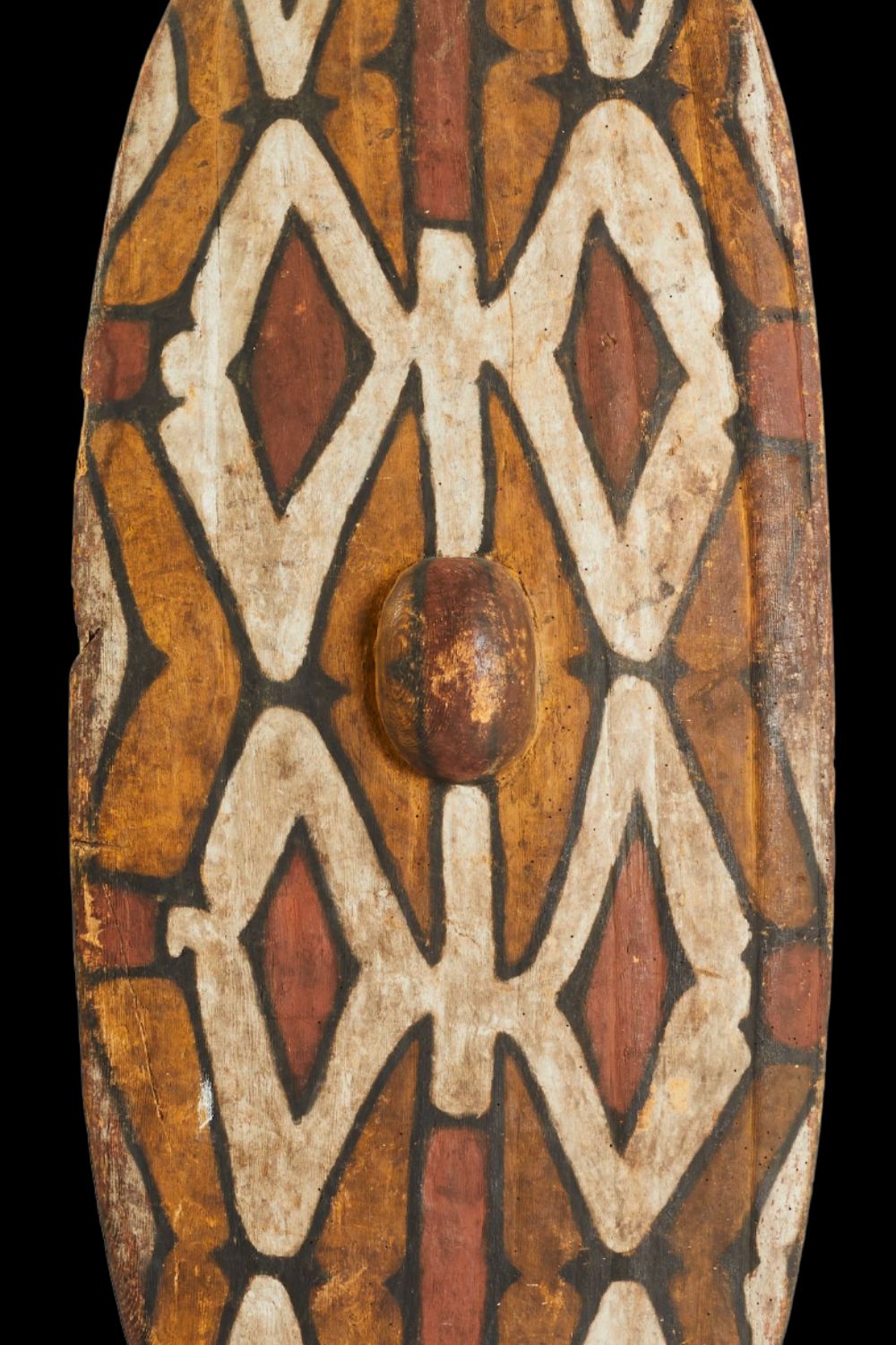 Early Port Keats Aboriginal bark painting by Charlie Mardigan featuring concentric ceremonial designs in natural ochres on elongated eucalyptus bark