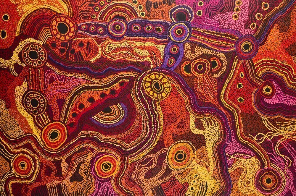 Painting by Sandra Ken featuring vibrant red, orange, purple, and yellow dot work depicting interconnected sacred sites and ancestral pathways associated with the Seven Sisters Dreaming.