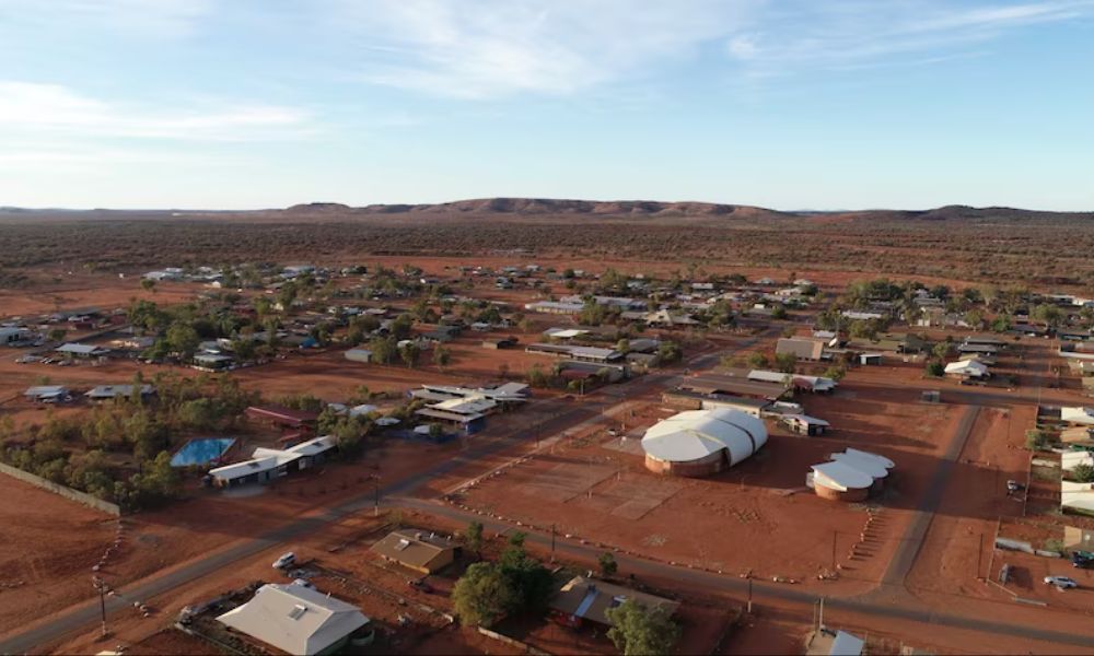 Aerial view of Yuendumu Aboriginal community in the Northern Territory, surrounded by the red desert landscape of Central Australia.