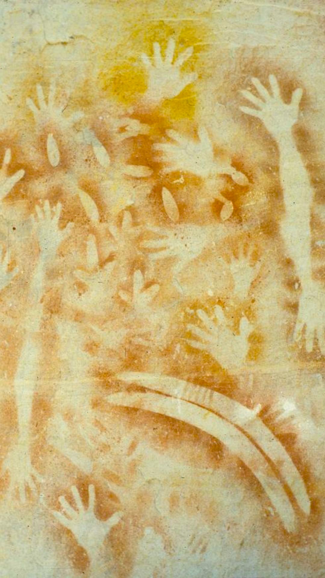 Ancient Aboriginal hand stencils and boomerang motifs at Carnarvon Gorge rock art site in Central Queensland