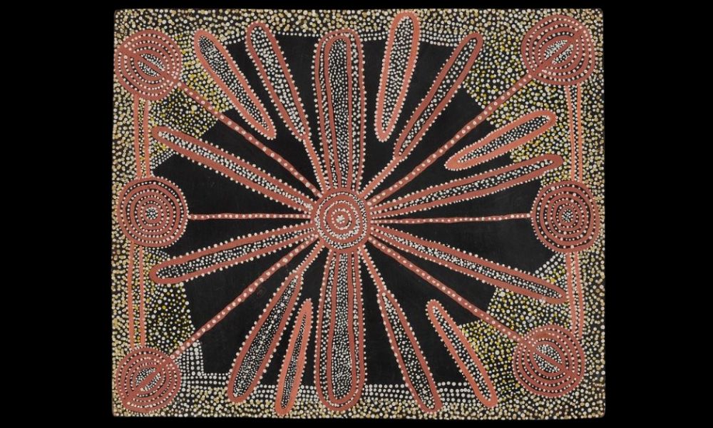 Early Western Desert painting by Charlie Tjungurrayi featuring concentric circles, radiating ceremonial forms, and sparse negative space associated with the Papunya movement