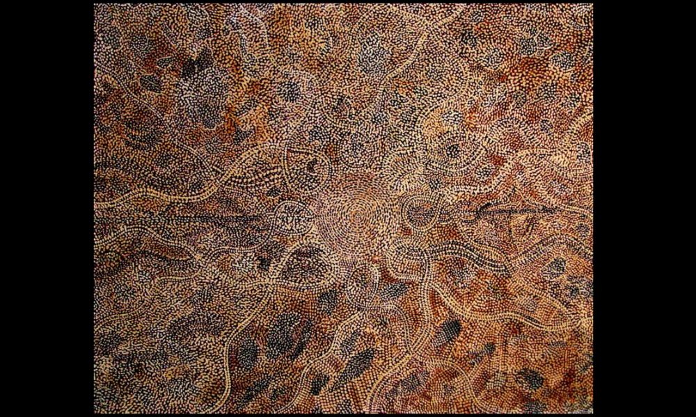 Early Western Desert painting by Tim Leura Tjapaltjarri featuring flowing dot fields, ceremonial pathways, and symbolic Papunya imagery