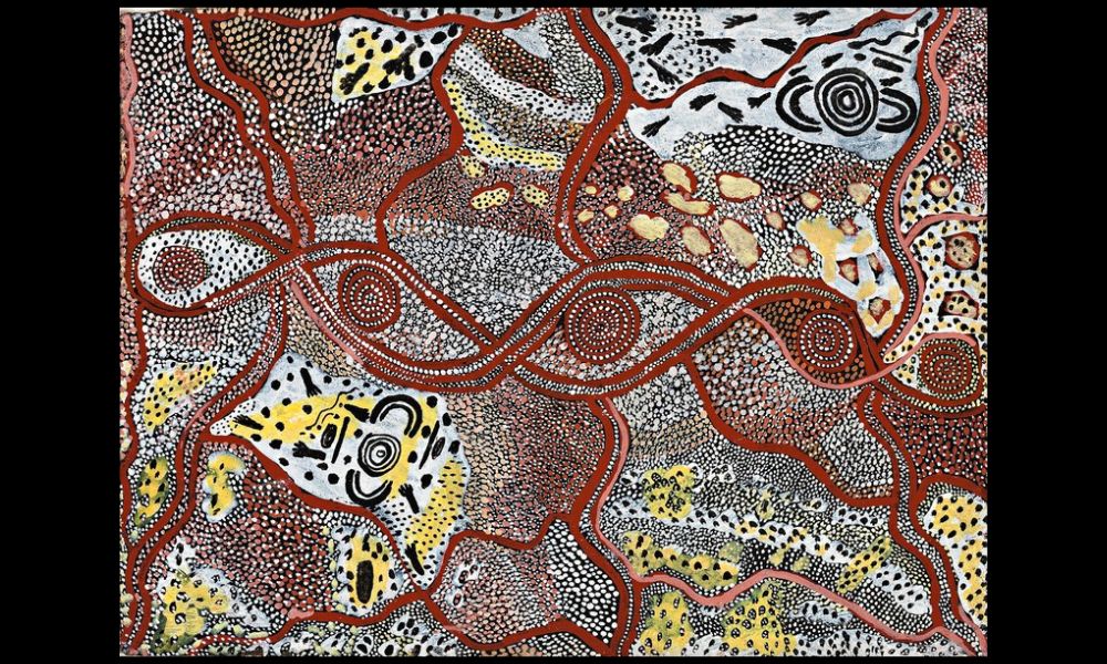 Early Papunya painting by Johnny Warangkula Tjupurrula featuring ceremonial imagery, dotted surfaces, and Water Dreaming symbolism from the Western Desert Art movement