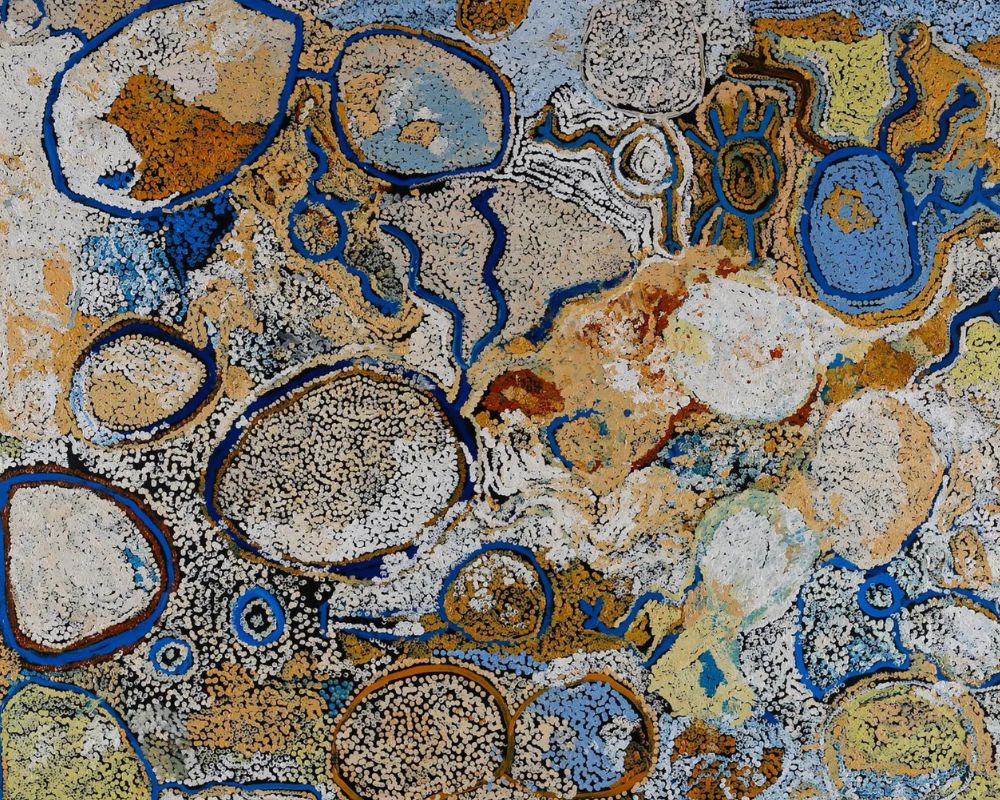 Aboriginal painting by Simon Hogan depicting interconnected waterholes, sacred sites, and desert landscapes across Spinifex Country using blue, white, ochre, and earth-toned forms.