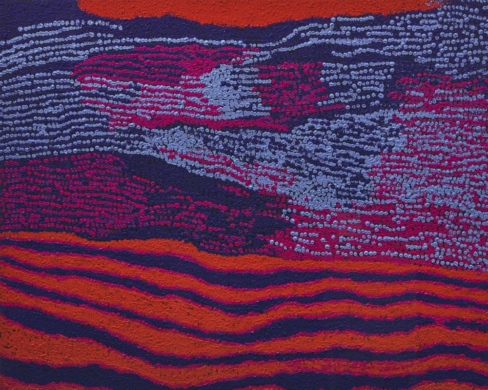 Large-scale Aboriginal painting by Tommy Watson featuring vivid red, purple, pink, and silver dotting representing ancestral Country in the Ngaanyatjarra Lands.