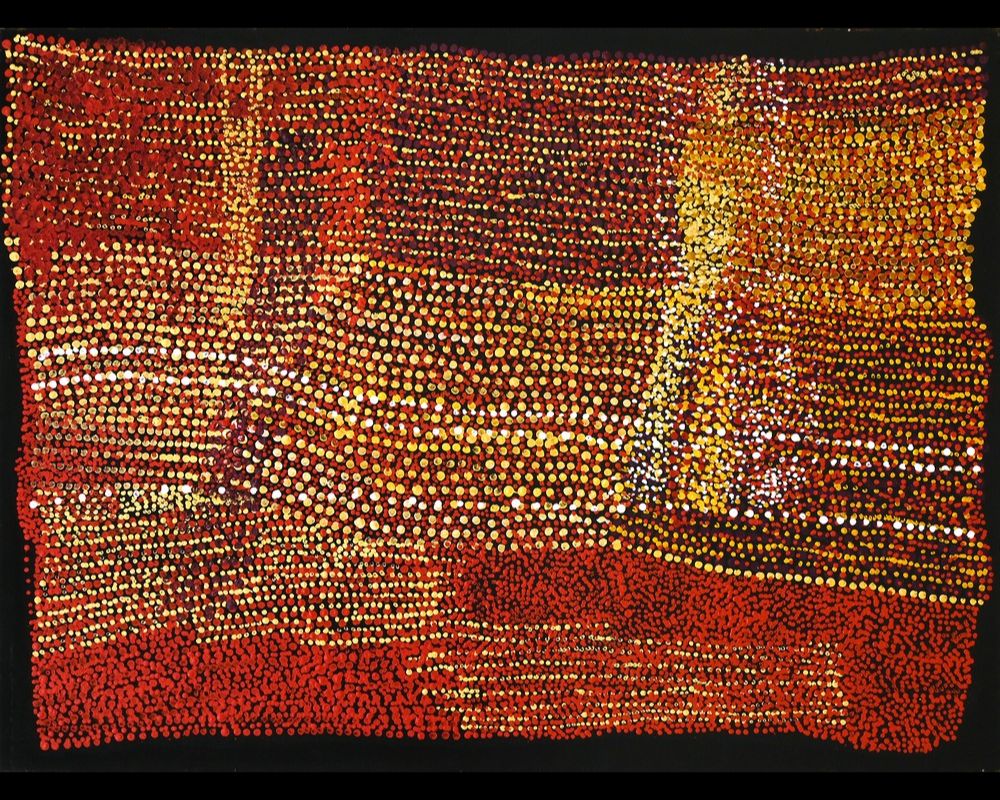 Aboriginal dot painting by Patju Presley depicting ancestral Country through rich red, orange, yellow, and white desert colours and intricate ceremonial patterning.