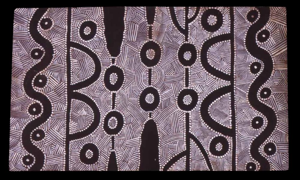 Early Papunya painting by Clifford Possum Tjapaltjarri featuring strong ceremonial linework, concentric circles, and symbolic Western Desert imagery