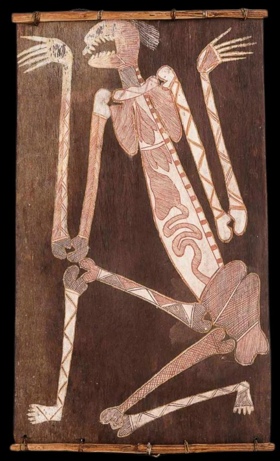 Important spirit figure bark painting by Dick Murrumurru from Western Arnhem Land featuring elongated ceremonial anatomy and fine parallel rarrk