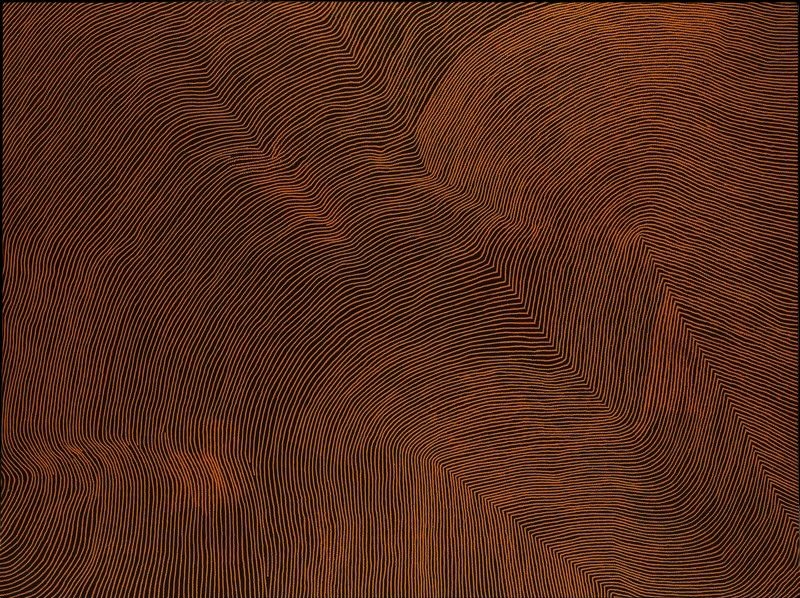 Untitled by Warlimpirrnga Tjapaltjarri, 2007. A monumental abstract Aboriginal painting in deep chocolate brown and warm burnt ochre. Thousands of extremely fine parallel lines sweep diagonally across the canvas, bending sharply to form broad angular pathways that intersect and flow around one another. The subtle contrast between the dark ground and ochre lines creates a quiet shimmering effect, while the composition resembles an aerial view of desert sandhills, ridges and ancestral pathways stretching across Country.