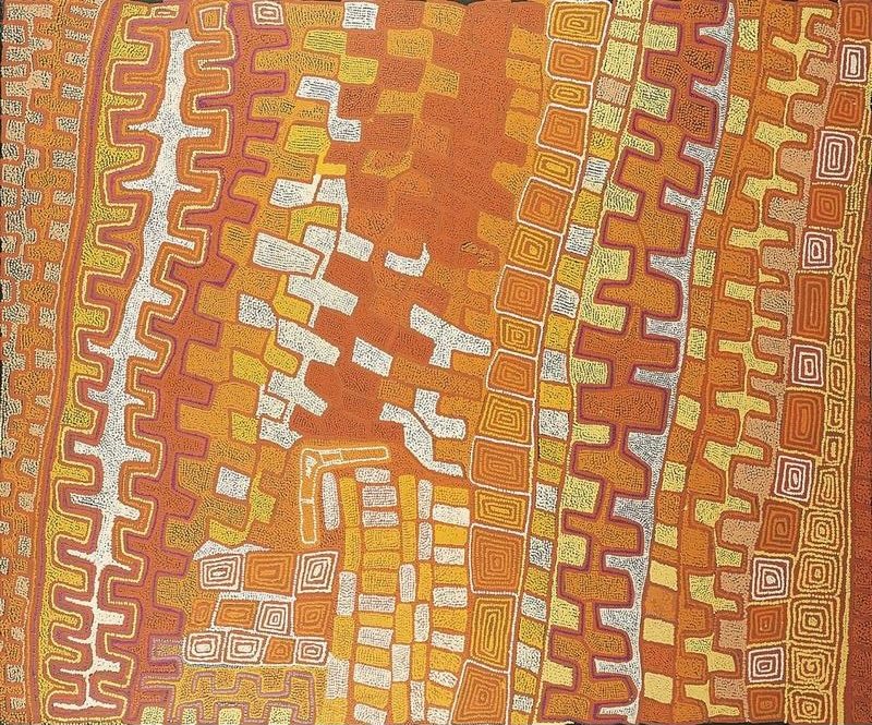 A large vertical Aboriginal painting in warm desert colours of burnt orange, terracotta, ochre, golden yellow, cream, white and soft magenta. Broad vertical bands fill the canvas, each composed of repeating stepped patterns, concentric rectangular motifs and flowing contour-like dotted lines. Near the centre, a wide field of glowing orange is crossed by irregular white pathways that branch diagonally through the composition like ancestral travelling routes. Narrow columns of nested squares and geometric blocks alternate with rhythmic zigzag bands, creating a richly layered surface that resembles an aerial view of interconnected landforms. Thousands of precisely placed dots define every line and colour transition, producing a shimmering optical effect and a powerful sense of vertical movement.