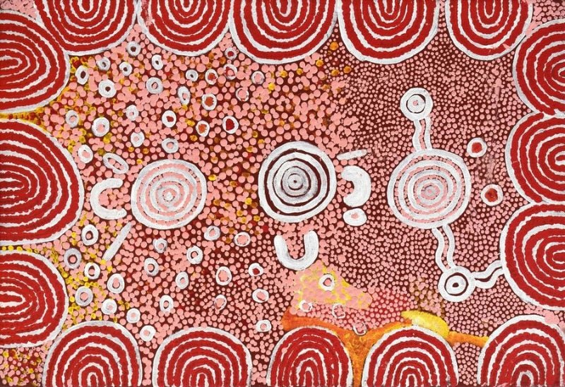 Naata Nungurrayi painting Untitled (2002), featuring concentric sandhill motifs framing ceremonial circles and finely dotted fields in deep red, pink and white associated with Pintupi Country.