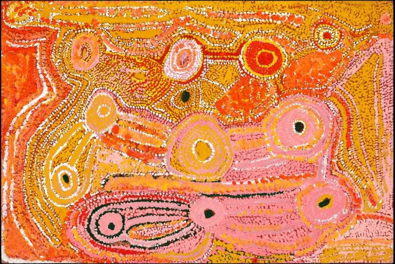 Untitled (1992) by Eubena Nampitjin featuring interconnected waterholes and ancestral pathways in vivid pink, orange and ochre tones.