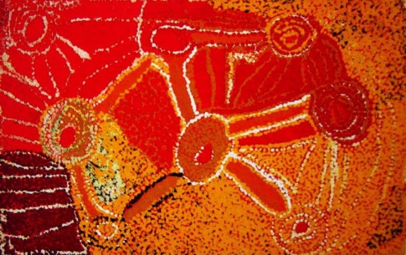 Nyilla (1992) by Eubena Nampitjin depicting the Nyilla landscape with interconnected waterholes and ancestral pathways in vivid red, orange and yellow ochres