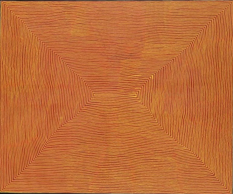 Untitled (Designs Associated with the Lake Site of Wilkinkarra (Lake Mackay)) by Warlimpirrnga Tjapaltjarri, 2005. A monumental painting in glowing orange, burnt ochre and deep brown. Thousands of fine parallel lines radiate inward from all four corners towards a narrow rectangular opening at the centre, creating a dramatic illusion of depth. The warm colours shimmer across the surface like sunlight over desert sand or the vast salt flats of Lake Mackay seen from above.
