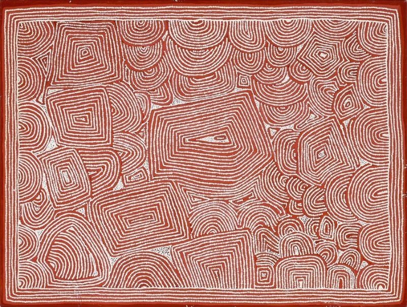 A rectangular Aboriginal painting in a restrained palette of deep reddish-brown, terracotta, cream and white. The entire surface is filled with thousands of evenly spaced white dots arranged in closely packed contour-like lines. Large angular diamond and trapezoid-shaped forms dominate the centre, each built from concentric bands that step inward toward a small central point. Around them, countless curved semicircular and horseshoe-shaped patterns interlock like ripples spreading across the landscape, leaving almost no empty space. A thick double border of white dotted lines frames the composition, reinforcing its precise geometry. The overall effect is calm, highly ordered and mesmerising, resembling an aerial view of interconnected landforms mapped through rhythmic dotted contours.