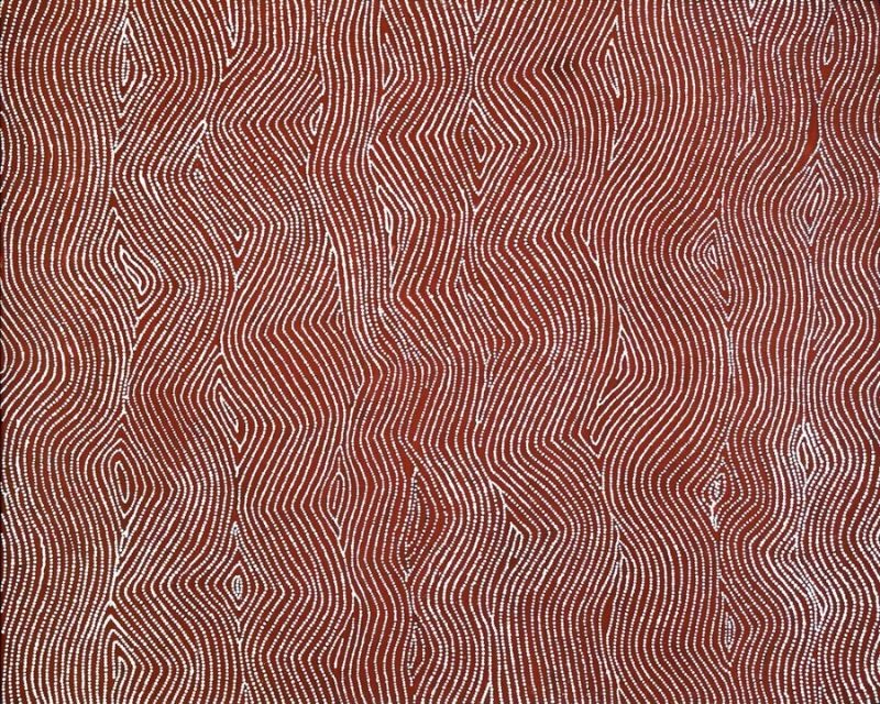 Tingari – West of Lake Mackay by Warlimpirrnga Tjapaltjarri, 2000. A large vertical painting in deep reddish-brown and white. Thousands of tiny white dots form flowing vertical bands that gently weave from side to side across the entire canvas. Elongated diamond-shaped openings appear at regular intervals between the lines, creating a shimmering optical effect like rippling sand, woven fibres or heat haze across the Western Desert.