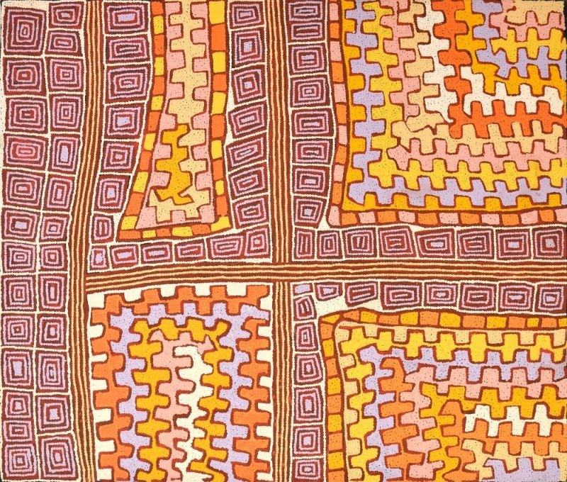A horizontal Aboriginal painting in warm desert colours of deep plum, burnt orange, golden yellow, cream, soft pink and pale lilac. The composition is divided into four large rectangular sections by broad intersecting pathways that form a cross across the canvas. Within each section are repeating stepped motifs arranged in neat rows, while the surrounding borders are filled with concentric rectangular patterns that resemble ceremonial ground designs viewed from above. Thousands of tiny dots create every line and colour transition, producing a finely textured surface with a subtle shimmering effect. The balanced geometry and intersecting pathways give the impression of an ordered aerial view of connected places across the Western Desert.