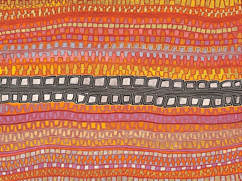 A monumental horizontal Aboriginal painting in radiant desert colours of burnt orange, terracotta, golden yellow, cream, white, soft lilac and black. The composition is formed from broad horizontal bands that flow across the canvas like parallel sand dunes seen from above. Most bands contain repeating stepped motifs, rectangular blocks and finely dotted contour lines in warm oranges and yellows. Cutting boldly through the centre is a striking black band bordered with white, filled with a row of large cream concentric rectangular shapes that create a dramatic visual contrast. Thousands of tiny dots define every line and colour transition, producing a shimmering optical surface that balances rhythmic repetition with the powerful central geometric motif.