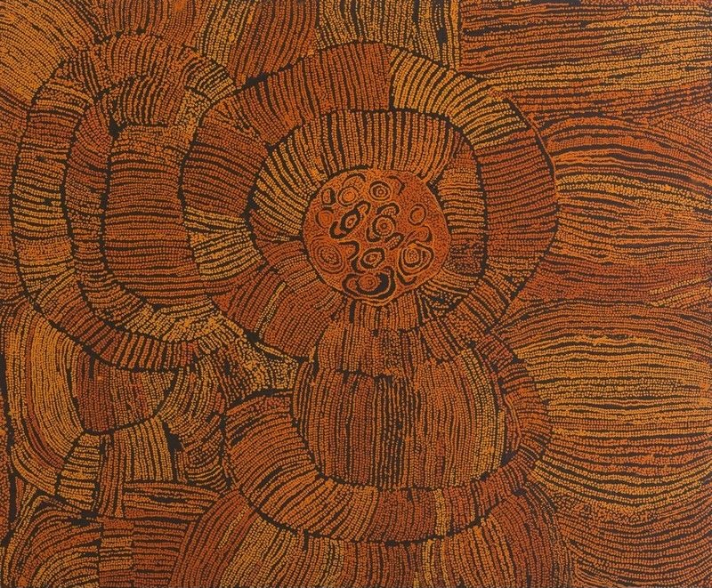 Naata Nungurrayi painting Marrapinti (2003), depicting concentric sandhill formations in rich ochre and burnt orange surrounding a central ceremonial rockhole motif on a dark ground.