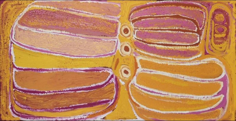 Wati Kutjarra by Eubena Nampitjin showing broad ochre, yellow and mauve sandhill forms, linked waterholes and white dotted contours in the Balgo painting style.