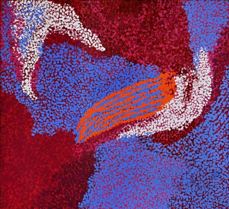 Pikarli (My Country) (2015) by Tommy Watson, acrylic on Belgian linen with vivid blue, crimson and white colour fields intersected by bright orange dotted forms representing ancestral Country.