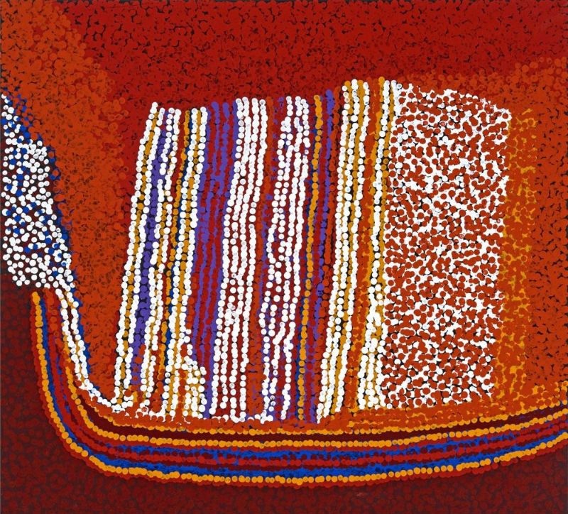 Untjulalkatja (2012) by Tommy Watson, acrylic on Belgian linen featuring vertical bands of white, violet and ochre dots against deep crimson colour fields in an abstract depiction of Western Desert Country.