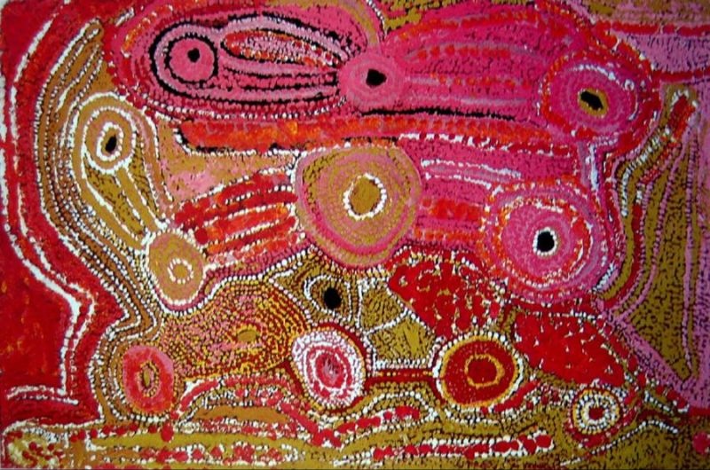Untitled (1992) by Eubena Nampitjin featuring interconnected waterholes and ancestral pathways in vivid pink, red and ochre tones.
