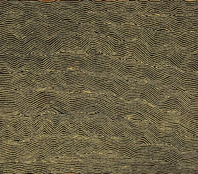 Wilkinkarra (Lake Mackay) by Warlimpirrnga Tjapaltjarri, 2000. A horizontal painting in black, cream and warm ochre. Thousands of tiny cream dots form gently undulating horizontal lines that flow across a deep black background. Small almond-shaped openings appear rhythmically between the lines, creating a shimmering optical effect like wind rippling across desert sand or reflections moving over water at dusk.