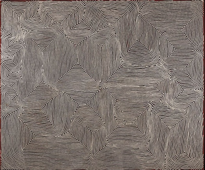 Kalparti by Warlimpirrnga Tjapaltjarri, 2003. A monumental horizontal painting in black, white and soft grey. Thousands of fine white dotted lines ripple across a dark background, folding into broad stepped pathways, angular bends and elongated rectangular forms. The flowing lines create a powerful shimmering optical effect, resembling shifting sand dunes, carved ceremonial designs or the contours of the Western Desert seen from above.