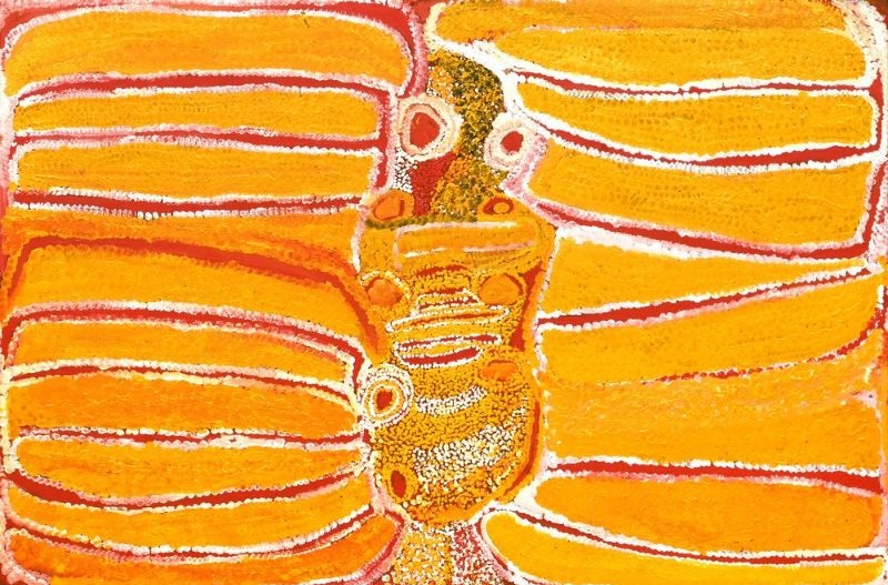 Witji by Eubena Nampitjin showing glowing yellow and orange sandhill forms surrounding a central chain of rockholes with white dotted contours in the Balgo painting style