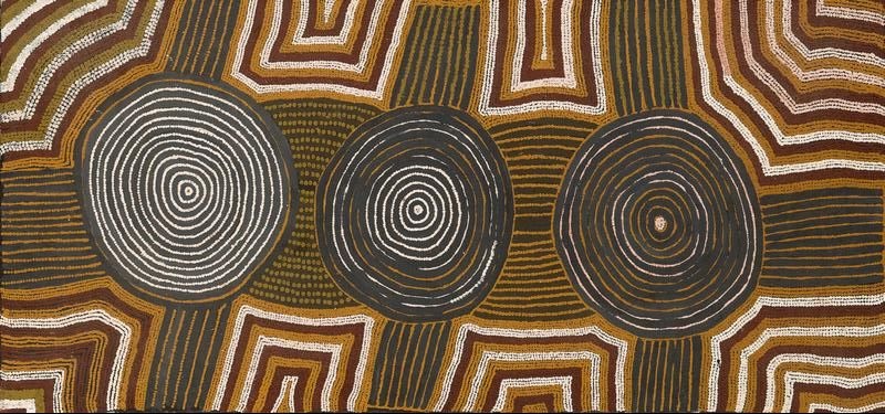 Untitled by Warlimpirrnga Tjapaltjarri, 1988, synthetic polymer paint on linen depicting concentric circles and geometric Tingari designs in ochre, black and white.