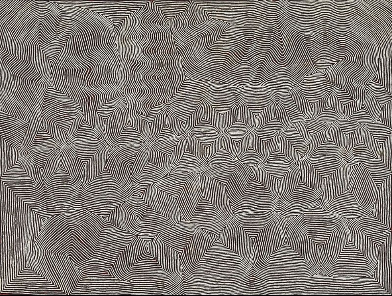 Marawa by Warlimpirrnga Tjapaltjarri, 2004. A monumental horizontal painting in black, white and soft grey. Thousands of tiny white dots form dense parallel lines that weave across the canvas in sweeping curves, sharp angles and interlocking pathways. A broad horizontal band of stepped geometric motifs runs through the centre, while the upper and lower sections undulate like wind-blown sand dunes. The shimmering monochrome surface creates a powerful optical illusion of movement across the desert landscape.