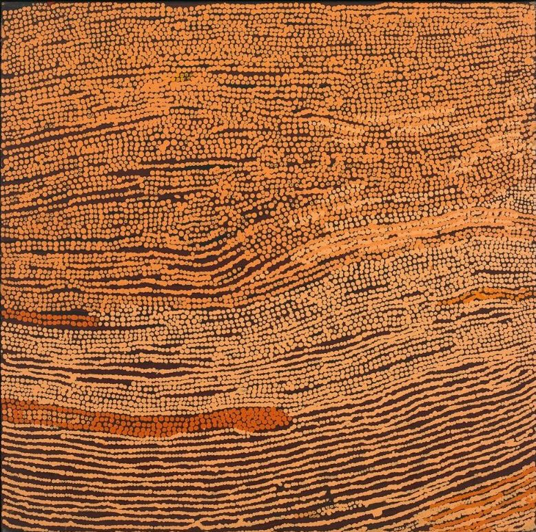 Naata Nungurrayi painting Untitled (2004), depicting flowing parallel bands of ochre and terracotta dotting that evoke the rolling sandhills of the Western Desert in an elegant abstract composition.