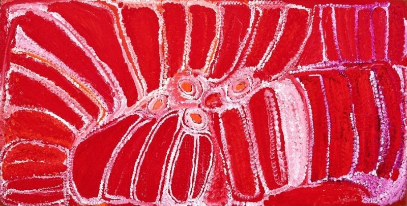 Wati Kutjarra by Eubena Nampitjin showing vivid crimson and pink sandhill forms, linked waterholes and white dotted contours in the Balgo painting style